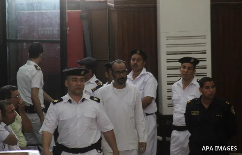 Suspects of Ansar Bait Al-Maqdis group, attend thier trial in a court room, in Cairo on May 19, 2015. Photo by Stringer