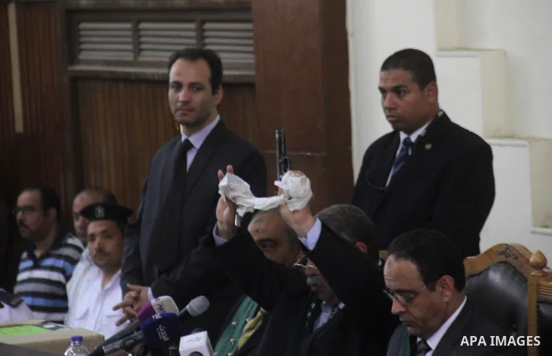 the Judge displays the weapons used by Ansar Bait Al-Maqdis group, during their trial in Cairo on May 19, 2015. Photo by Stringer