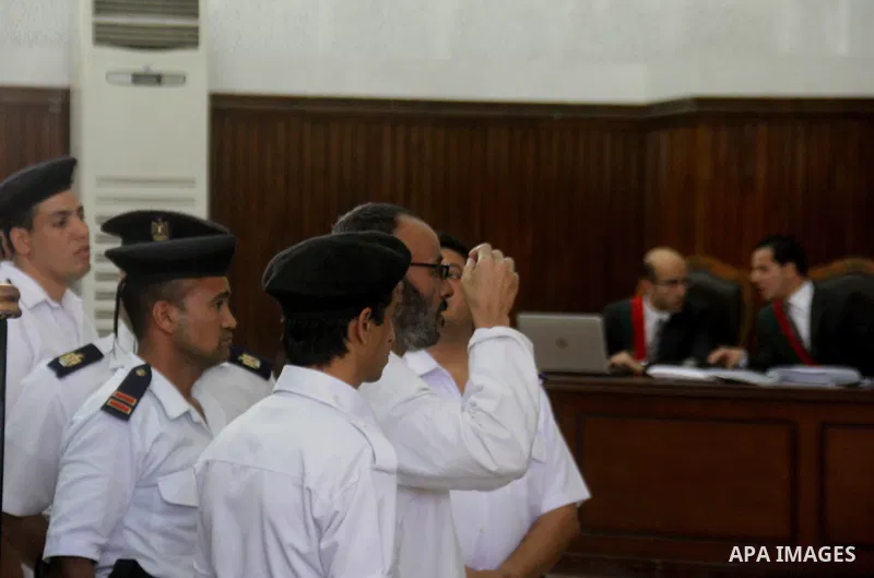 Suspects of Ansar Bait Al-Maqdis group, attend thier trial in a court room, in Cairo on May 19, 2015. Photo by Stringer