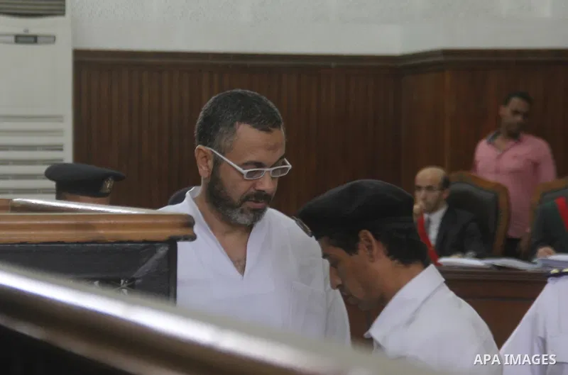Suspects of Ansar Bait Al-Maqdis group, attend thier trial in a court room, in Cairo on May 19, 2015. Photo by Stringer