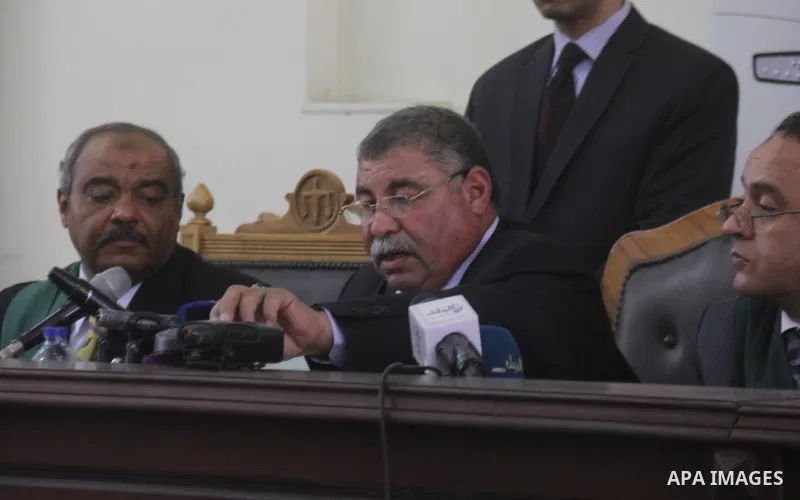 the Judge displays the weapons used by Ansar Bait Al-Maqdis group, during their trial in Cairo on May 19, 2015. Photo by Stringer