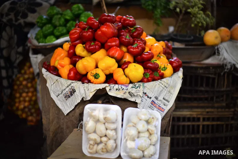 Fruits and vegetables are displayed at a street market in Ad Duqqi district, near Cairo on May 19, 2015. Egypt suspended a capital gains tax on Monday, sending shares soaring after a months-long downturn in which investo...
