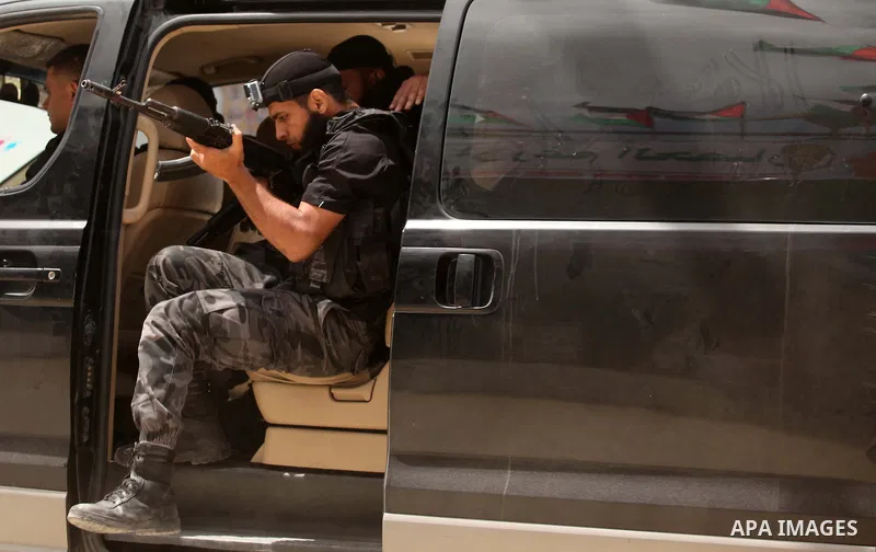 Palestinian security forces show their skills during a military training graduation ceremony in Gaza City on May 21, 2015. Photo by Ashraf Amra