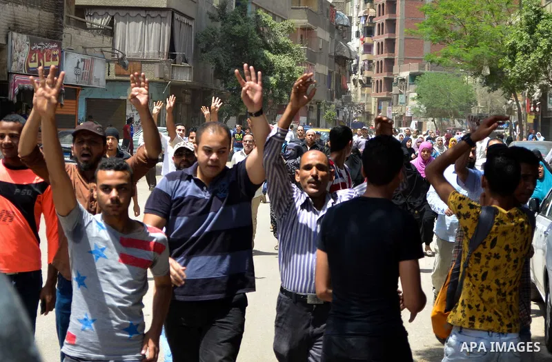 Egyptian supporters of the Muslim Brotherhood and ousted President Mohamed Morsi, shout slogans during a demonstration against the military and interior ministry, in al-Matariya district, near Cairo on May 22, 2015. Phot...