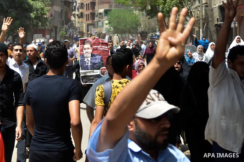 Egyptian supporters of the Muslim Brotherhood and ousted President Mohamed Morsi, shout slogans during a demonstration against the military and interior ministry, in al-Matariya district, near Cairo on May 22, 2015. Phot...