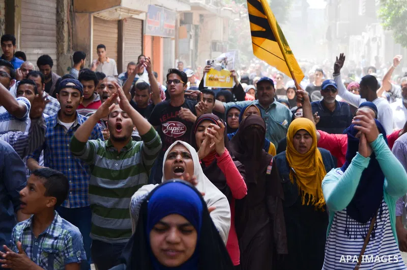 Egyptian supporters of the Muslim Brotherhood and ousted President Mohamed Morsi, shout slogans during a demonstration against the military and interior ministry, in al-Matariya district, near Cairo on May 22, 2015. Phot...