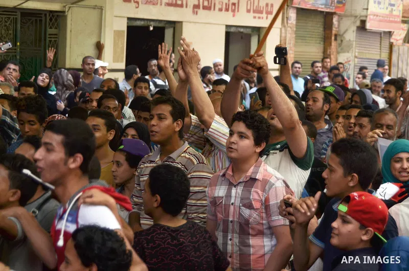 Egyptian supporters of the Muslim Brotherhood and ousted President Mohamed Morsi, shout slogans during a demonstration against the military and interior ministry, in al-Matariya district, near Cairo on May 22, 2015. Phot...