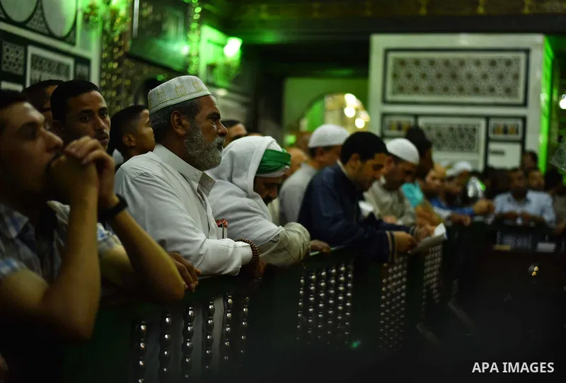 Egyptian worshippers attend a Mawlid al-Hussein, a religious celebration marking the birthday of the grandson of the Prophet Muhammad, in Cairo, Egypt, Tuesday, May 22, 2015. The celebration is one of the largest in Egyp...