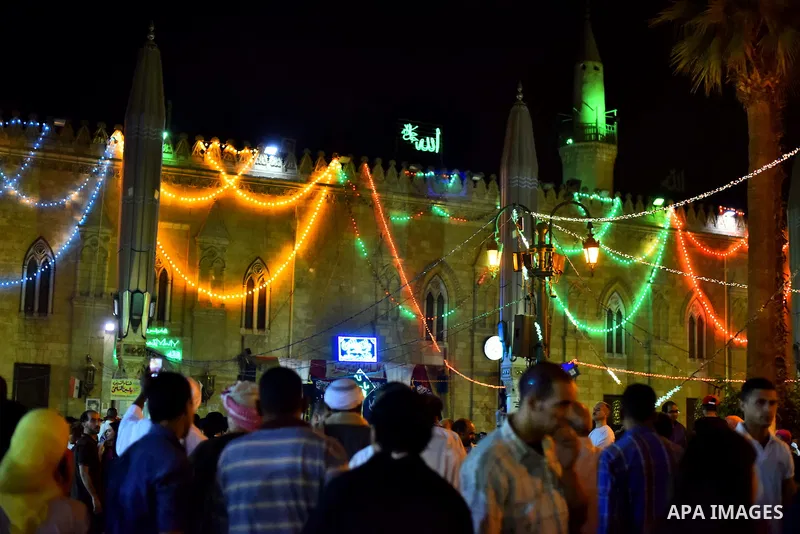 Egyptian worshippers attend a Mawlid al-Hussein, a religious celebration marking the birthday of the grandson of the Prophet Muhammad, in Cairo, Egypt, Tuesday, May 22, 2015. The celebration is one of the largest in Egyp...