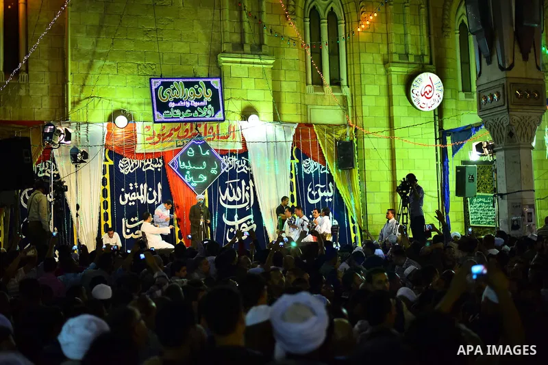 Egyptian worshippers attend a Mawlid al-Hussein, a religious celebration marking the birthday of the grandson of the Prophet Muhammad, in Cairo, Egypt, Tuesday, May 22, 2015. The celebration is one of the largest in Egyp...