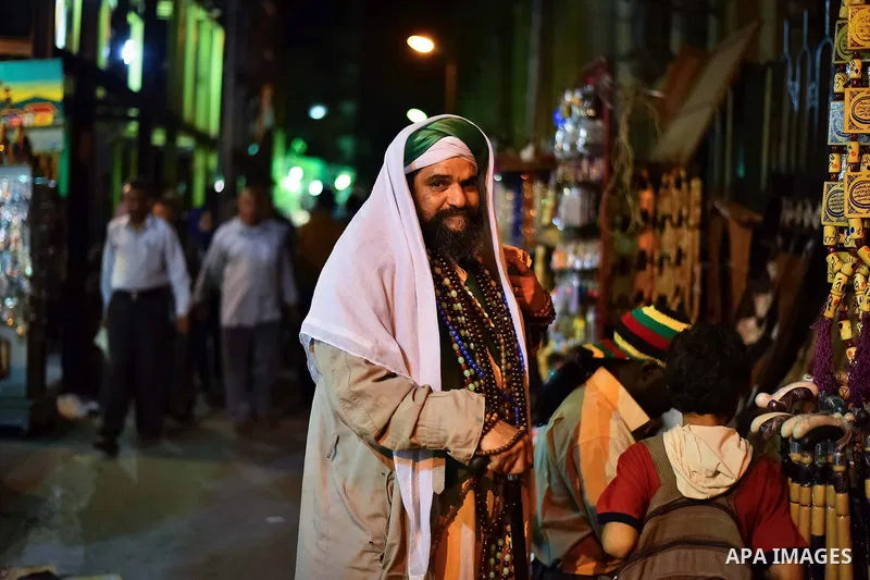 Egyptian worshippers attend a Mawlid al-Hussein, a religious celebration marking the birthday of the grandson of the Prophet Muhammad, in Cairo, Egypt, Tuesday, May 22, 2015. The celebration is one of the largest in Egyp...