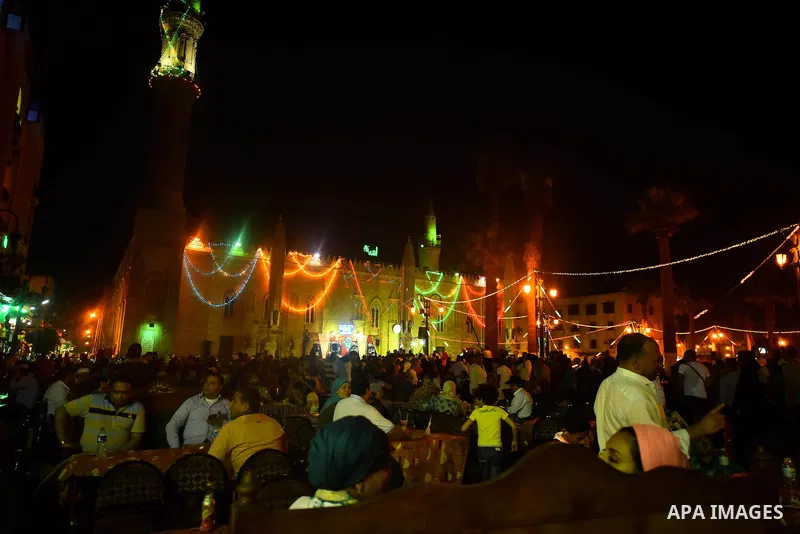 Egyptian worshippers attend a Mawlid al-Hussein, a religious celebration marking the birthday of the grandson of the Prophet Muhammad, in Cairo, Egypt, Tuesday, May 22, 2015. The celebration is one of the largest in Egyp...