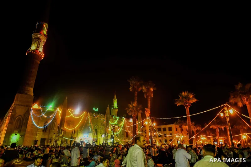Egyptian worshippers attend a Mawlid al-Hussein, a religious celebration marking the birthday of the grandson of the Prophet Muhammad, in Cairo, Egypt, Tuesday, May 22, 2015. The celebration is one of the largest in Egyp...
