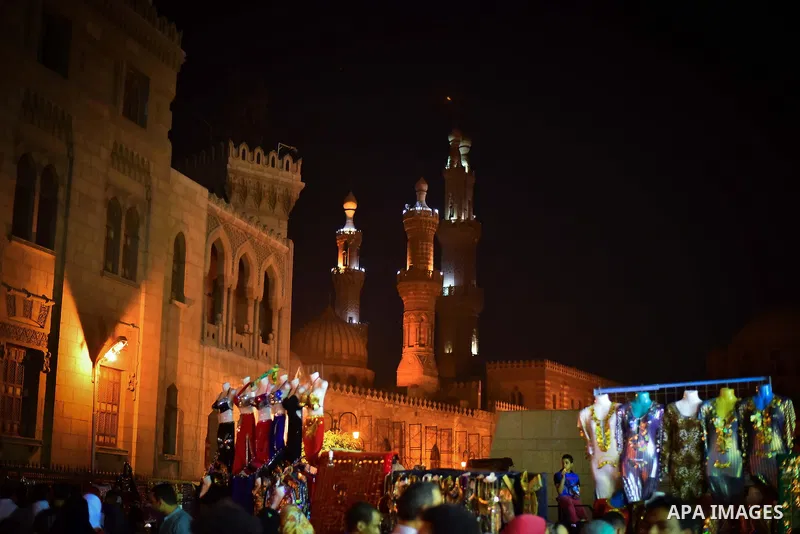 Egyptian worshippers attend a Mawlid al-Hussein, a religious celebration marking the birthday of the grandson of the Prophet Muhammad, in Cairo, Egypt, Tuesday, May 22, 2015. The celebration is one of the largest in Egyp...