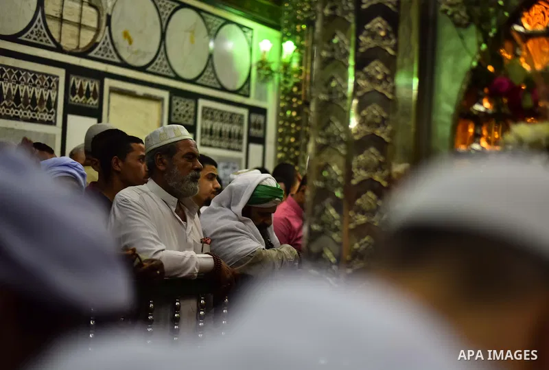 Egyptian worshippers attend a Mawlid al-Hussein, a religious celebration marking the birthday of the grandson of the Prophet Muhammad, in Cairo, Egypt, Tuesday, May 22, 2015. The celebration is one of the largest in Egyp...