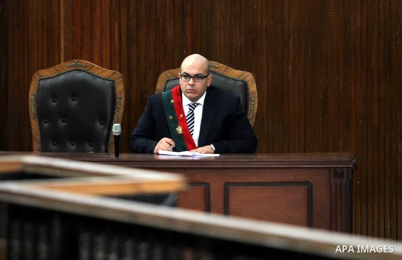 An Egyptian Judges attend the trial of Muslim Brotherhood's Supreme Guide Mohamed Badie at a court in the outskirts of Cairo, Egypt May 23, 2015. Photo by Stranger