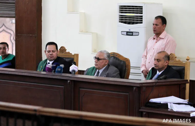 An Egyptian Judges attend the trial of Muslim Brotherhood's Supreme Guide Mohamed Badie at a court in the outskirts of Cairo, Egypt May 23, 2015. Photo by Stranger