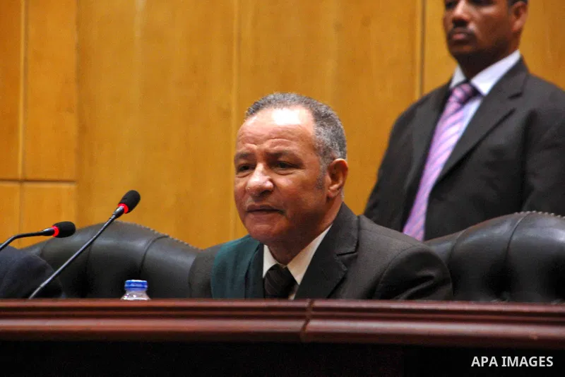 Egyptian Judges attend the trial of Ousted Egyptian president Mohamed Morsi for insulting the judiciary alongside 25 other defendants, in Cairo on May 23, 2015. Photo by Stranger