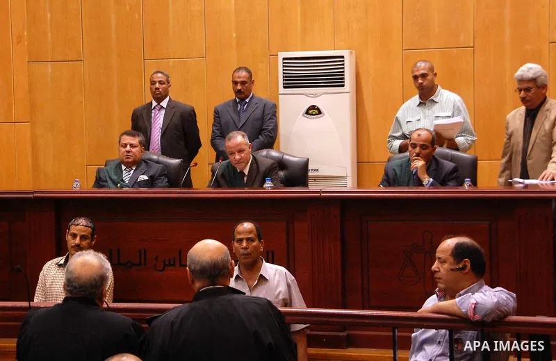 Egyptian Judges attend the trial of Ousted Egyptian president Mohamed Morsi for insulting the judiciary alongside 25 other defendants, in Cairo on May 23, 2015. Photo by Stranger