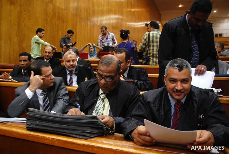 Egyptian Lawyers attend the trial of Ousted Egyptian president Mohamed Morsi for insulting the judiciary alongside 25 other defendants, in Cairo on May 23, 2015. Photo by Stranger