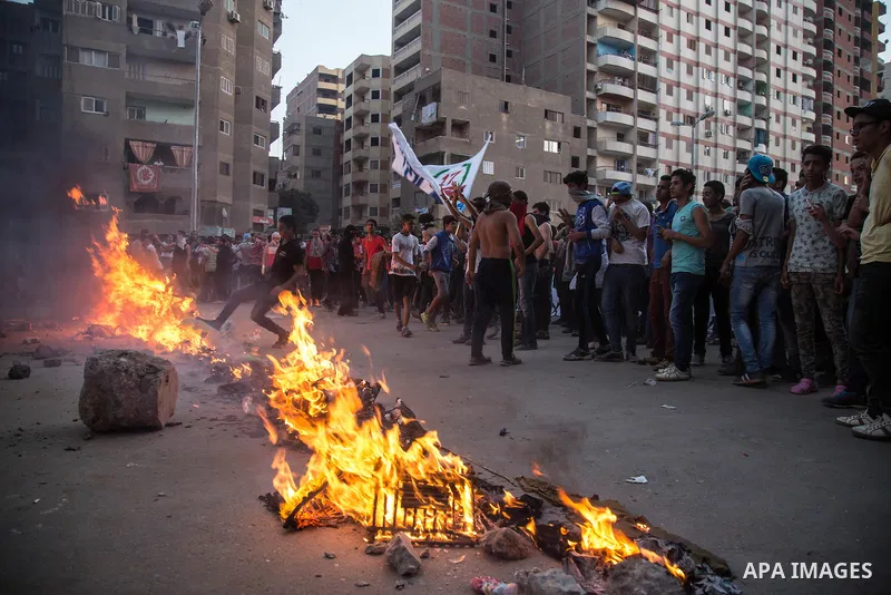 Egyptian protesters participate in a demonstration against the military regime on the outskirts of Cairo, Egypt, on May 23, 2015. Cairo Criminal Court on Saturday postponed to July 27 the trial of ousted Islamist Egyptia...
