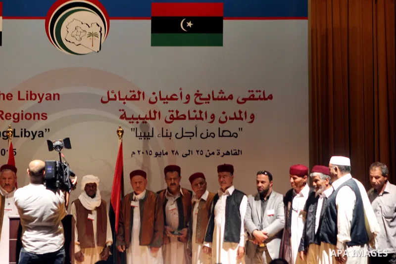 Participants listen to a speech during a conference at the Cairo hotel in the capital Cairo, on May 25, 2015. A four-day meeting of Libyan tribal leaders opened earlier in the day with the aim of exploring ways to unite...