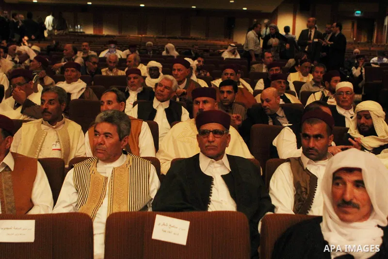 Participants listen to a speech during a conference at the Cairo hotel in the capital Cairo, on May 25, 2015. A four-day meeting of Libyan tribal leaders opened earlier in the day with the aim of exploring ways to unite...