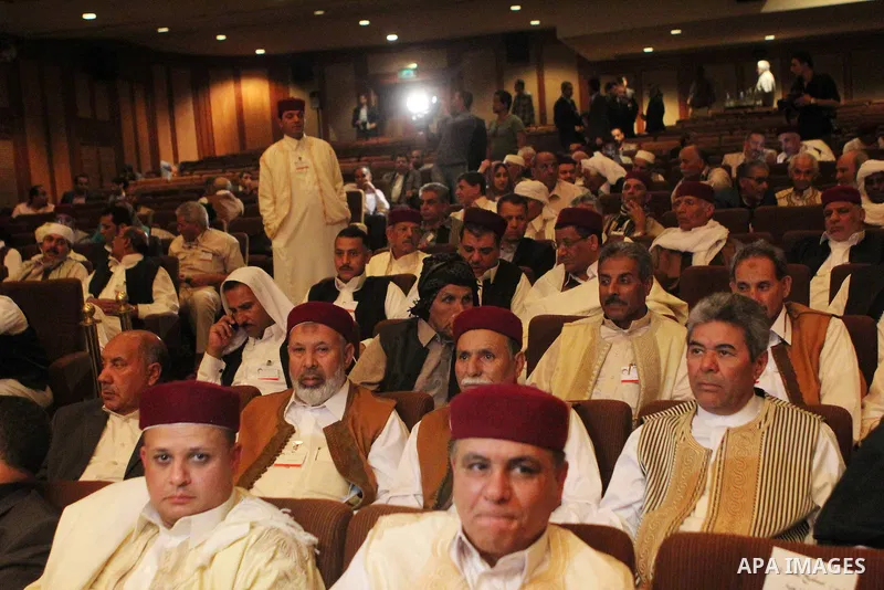 Participants listen to a speech during a conference at the Cairo hotel in the capital Cairo, on May 25, 2015. A four-day meeting of Libyan tribal leaders opened earlier in the day with the aim of exploring ways to unite...