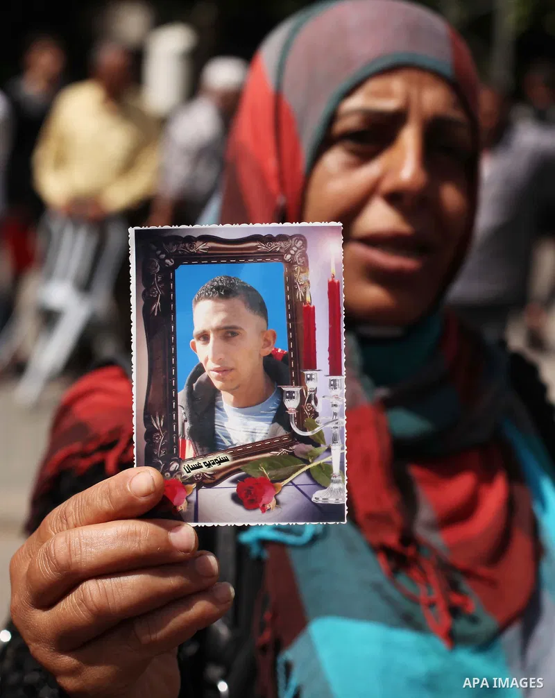 Palestinian families of martyrs take part a protest to demand their rights, in front of the headquarters of the Council of Ministers in Gaza city, on May 26, 2015. Photo by Ashraf Amra