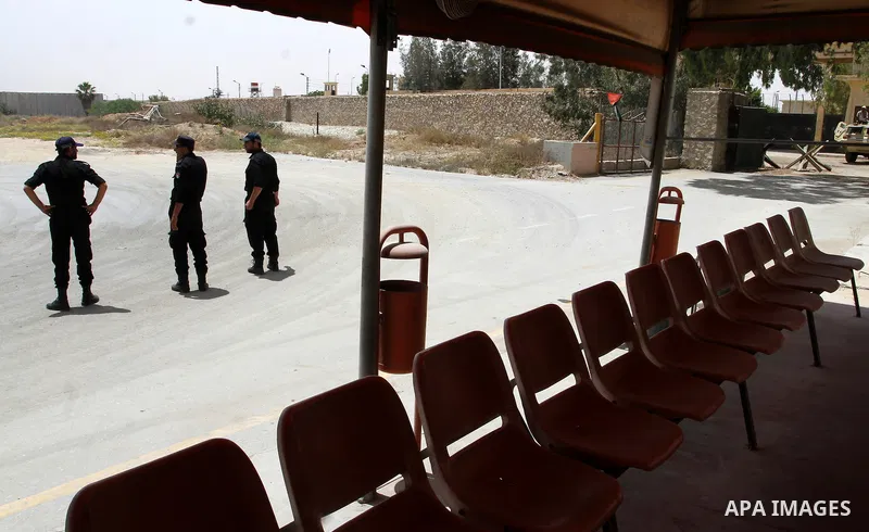 Palestinian policemen stand guard at the Rafah border crossing between Egypt and southern Gaza Strip May 26, 2015. Egyptian authorities opened the Rafah crossing on Tuesday, for the first time in nearly 80 days, to allow...