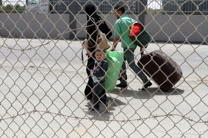 Palestinians arrive to the Gaza Strip through the Rafah border crossing between Egypt and the southern Gaza Strip May 27, 2015. Egyptian authorities opened the Rafah crossing on Tuesday and Wednesday, for the first time...