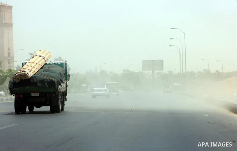 Cars are seen walk in a sandstorm in downtown Cairo on May 27, 2015. Hot weather with sandstorm hit Egypt on Wednesday, and the temperature reached 44 degree Celsius (111 degree Fahrenheit) at noon in some regions of the...