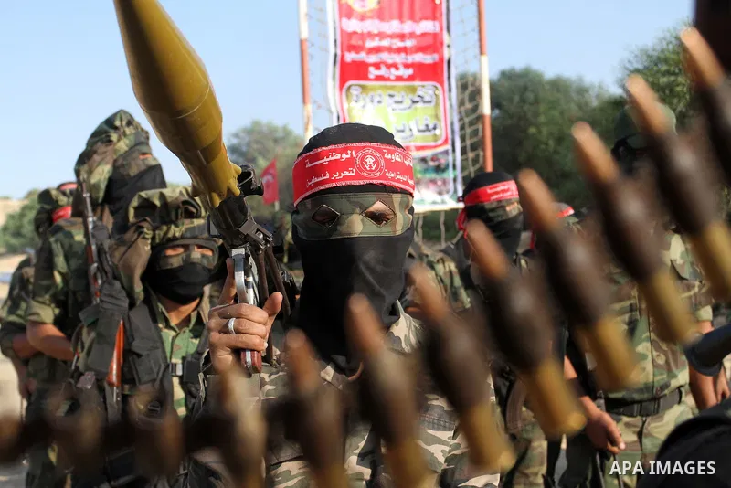 Masked Palestinian militants of the National Resistance Brigades, a group linked to the Democratic Front for the Liberation of Palestine, demonstrate their skills during a training exercise in Khan Younis in the southern...