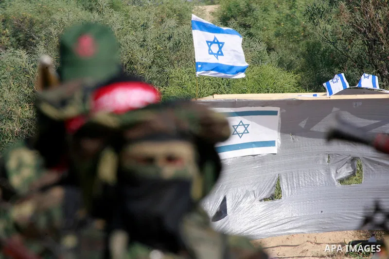 Masked Palestinian militants of the National Resistance Brigades, a group linked to the Democratic Front for the Liberation of Palestine, demonstrate their skills during a training exercise in Khan Younis in the southern...