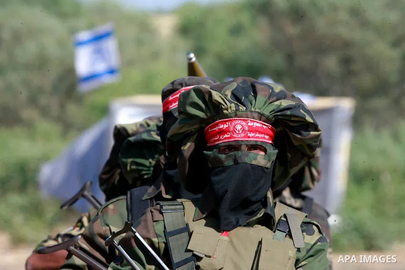 Masked Palestinian militants of the National Resistance Brigades, a group linked to the Democratic Front for the Liberation of Palestine, demonstrate their skills during a training exercise in Khan Younis in the southern...