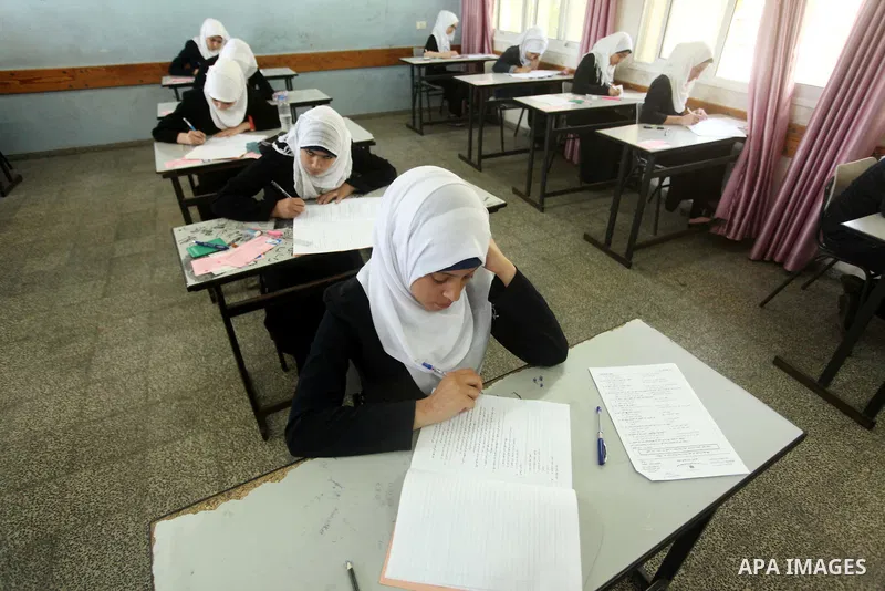 Palestinian female students sit for their final high school exams, known as "Tawjihi", in Gaza city on May 30, 2015. Nearly 81,000 Palestinian students sat for the first session of their high school exams seeking to obta...