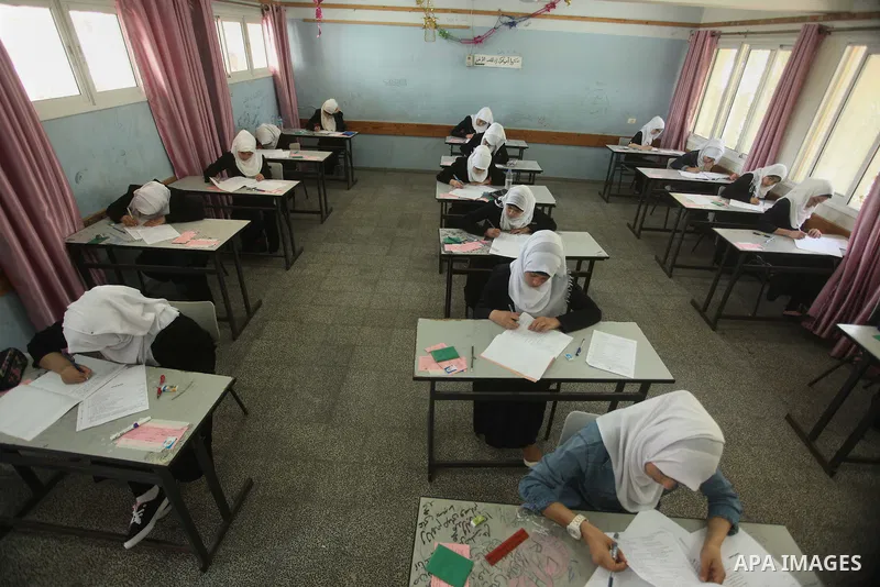 Palestinian female students sit for their final high school exams, known as "Tawjihi", in Gaza city on May 30, 2015. Nearly 81,000 Palestinian students sat for the first session of their high school exams seeking to obta...