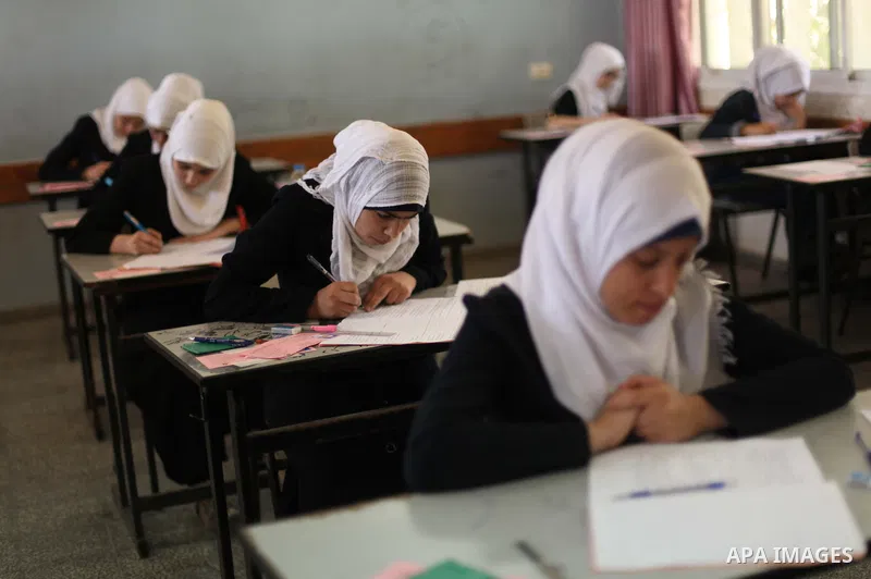 Palestinian female students sit for their final high school exams, known as "Tawjihi", in Gaza city on May 30, 2015. Nearly 81,000 Palestinian students sat for the first session of their high school exams seeking to obta...