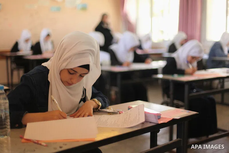 Palestinian female students sit for their final high school exams, known as "Tawjihi", in Gaza city on May 30, 2015. Nearly 81,000 Palestinian students sat for the first session of their high school exams seeking to obta...