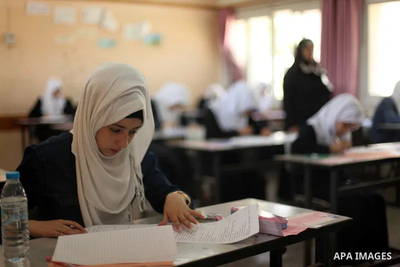 Palestinian female students sit for their final high school exams, known as "Tawjihi", in Gaza city on May 30, 2015. Nearly 81,000 Palestinian students sat for the first session of their high school exams seeking to obta...