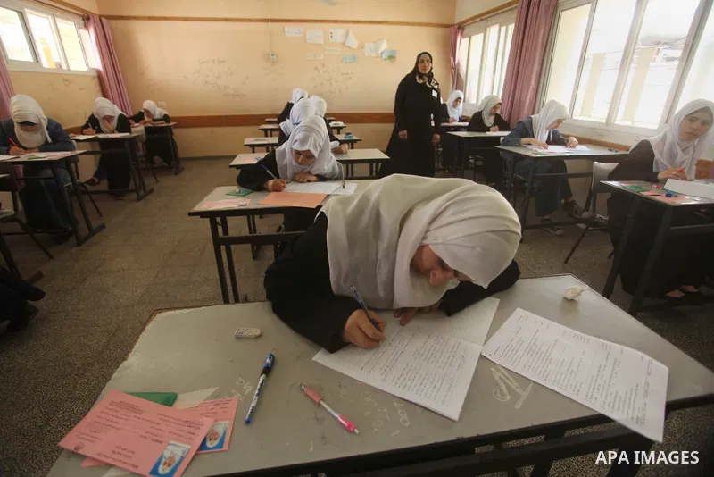 Palestinian female students sit for their final high school exams, known as "Tawjihi", in Gaza city on May 30, 2015. Nearly 81,000 Palestinian students sat for the first session of their high school exams seeking to obta...