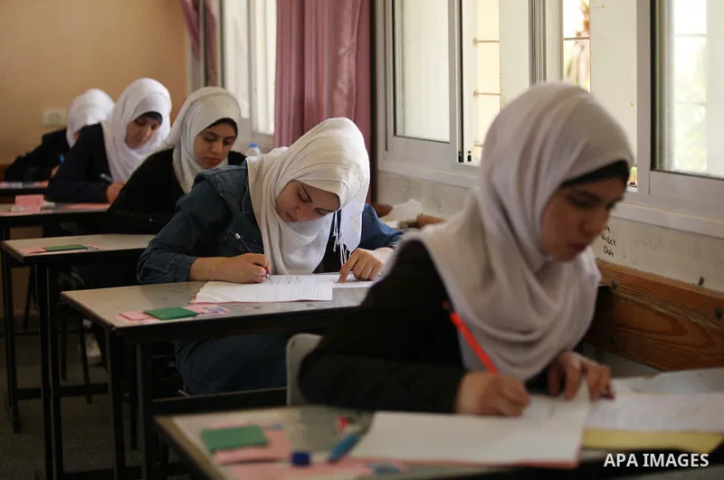 Palestinian female students sit for their final high school exams, known as "Tawjihi", in Gaza city on May 30, 2015. Nearly 81,000 Palestinian students sat for the first session of their high school exams seeking to obta...