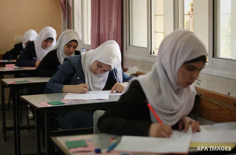 Palestinian female students sit for their final high school exams, known as "Tawjihi", in Gaza city on May 30, 2015. Nearly 81,000 Palestinian students sat for the first session of their high school exams seeking to obta...
