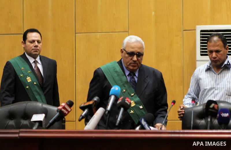 Egyptian Judges attend the trial of stadium riot in the canal city of Port Said that left 74 people dead on May 30, 2015 at the police academy in Cairo. The Egyptian court postponed its verdict to June 9, announced the j...