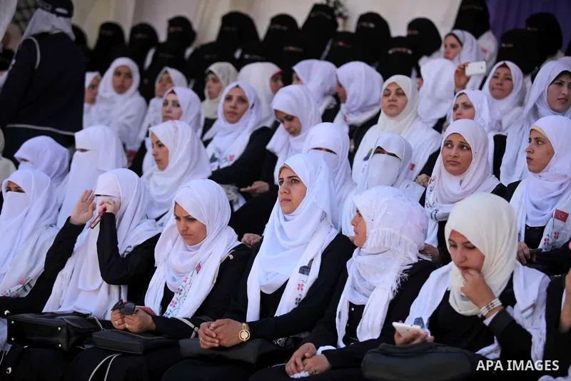 Palestinian brides take part in a mass wedding ceremony in Gaza city on May 31, 2015. Nearly 4000 Palestinian couples were married in a ceremony funded by Turkish government. Photo by Ashraf Amra