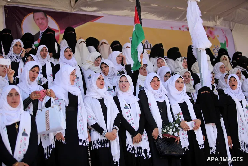 Palestinian brides take part in a mass wedding ceremony in Gaza city on May 31, 2015. Nearly 4000 Palestinian couples were married in a ceremony funded by Turkish government. Photo by Ashraf Amra