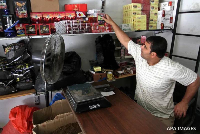 A Palestinian vendor displays hookah supplies at his shop in the southern Gaza Strip City of Rafah, on May 23, 2015. Smuggling through tunnels began several months after Islamic Hamas movement's control of the Gaza Strip...