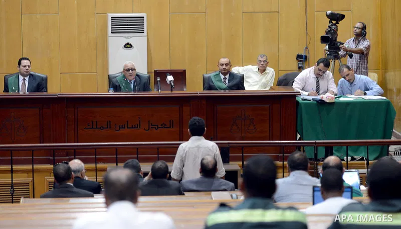 Judges attend the trial of defendants of the case of 2012 stadium riot in the canal city of Port Said that left 74 people dead on May 31, 2015 at the police academy in Cairo. The Egyptian court postponed its verdict to J...