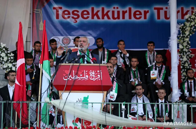 Senior Hamas leader Ismail Haniyeh gives a speech during a mass wedding ceremony in Gaza City, on May 31, 2015. Nearly 2000 Palestinian couples were married in a ceremony funded by the Turkish government and supported by...