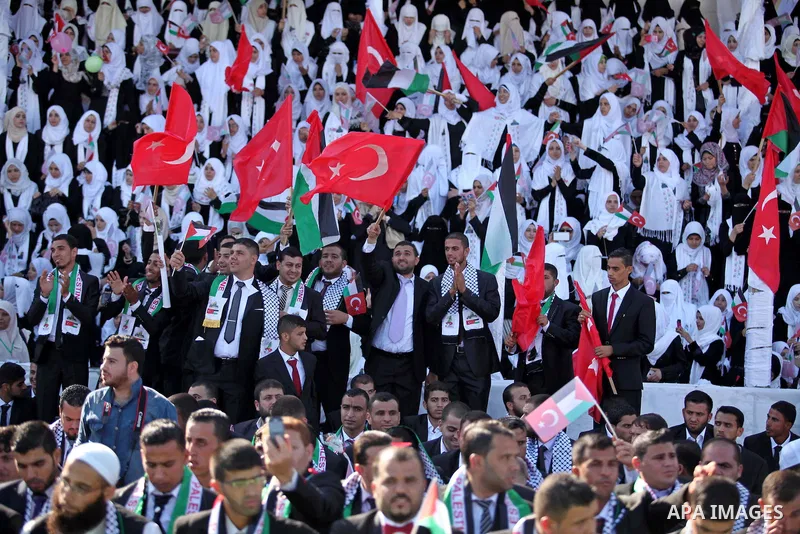 Palestinian grooms take part in a mass wedding ceremony in Gaza City, on May 31, 2015. Nearly 2000 Palestinian couples were married in a ceremony funded by the Turkish government and supported by the Hamas movement. Phot...